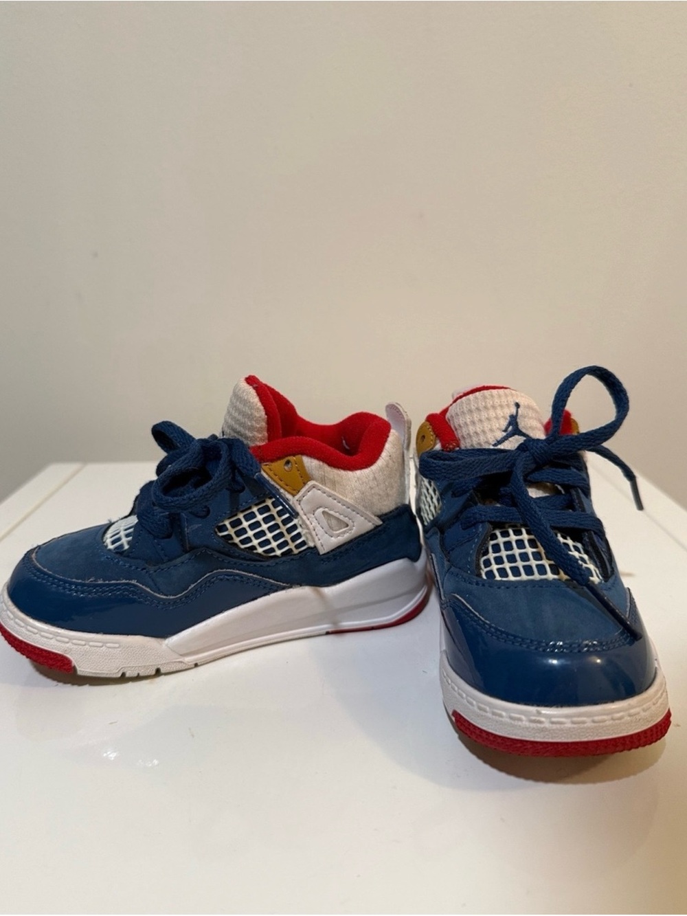 Jordan Kids 4 Retro Messy Room Red, White, and Blue 8c